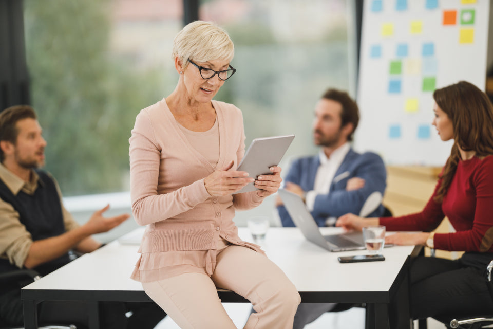 Small business owner reviewing plans on a tablet