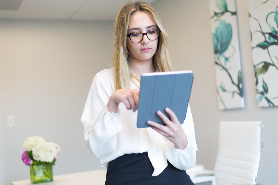 Woman checking her finances on a tablet